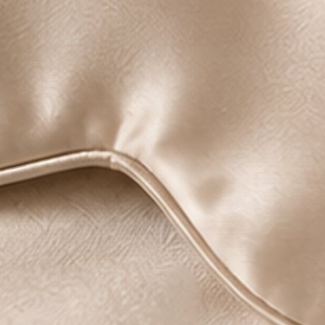 Close-up of the piped edge of the sleep mask.